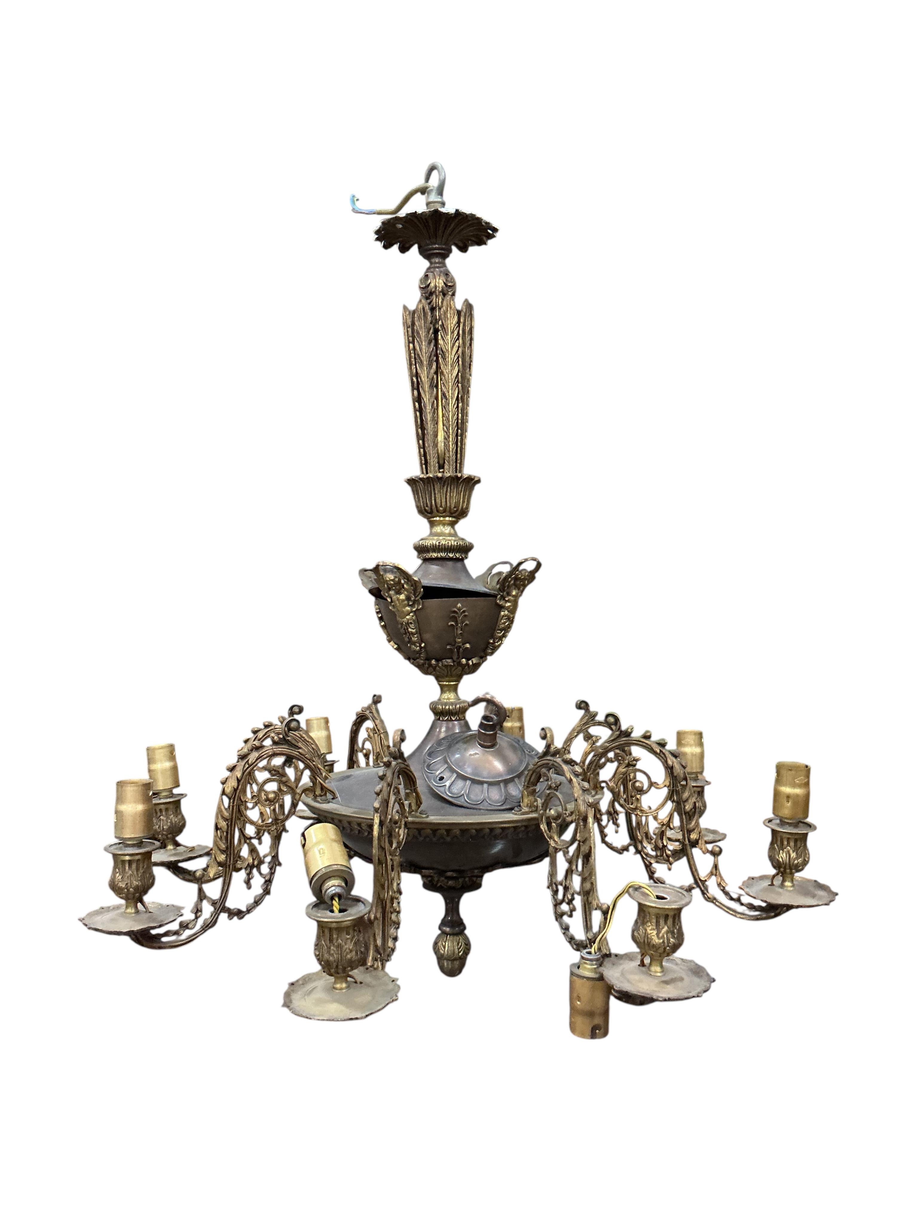 An Empire style gilt metal eight branch electrolier and two other light fittings.